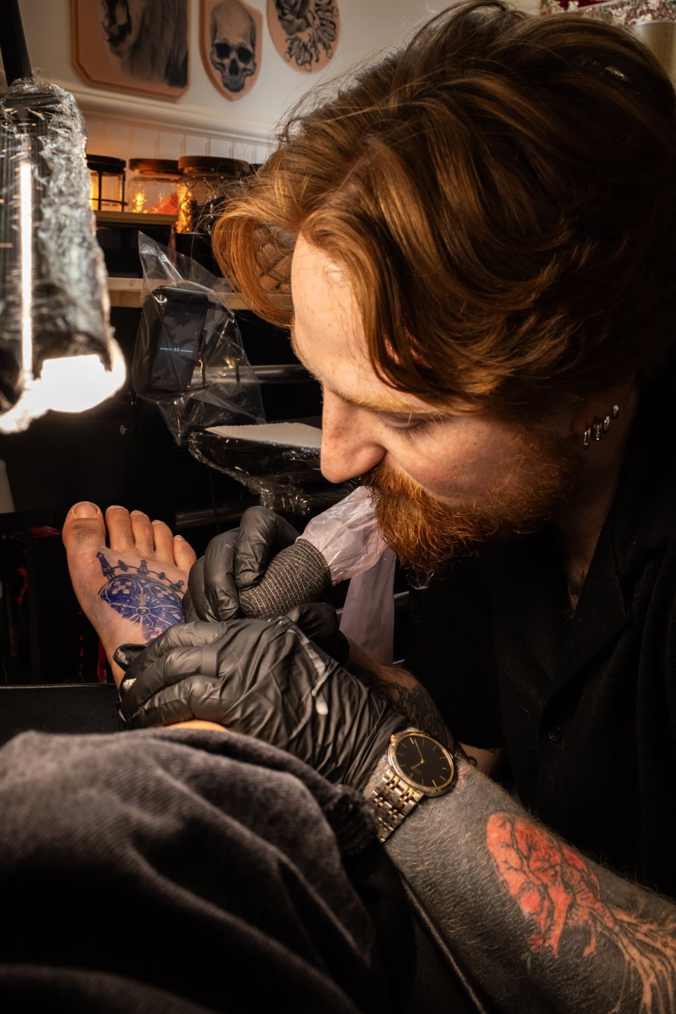 Chris Davis tattooing at Lost Lotus Ink